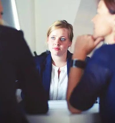 two girls are disscussing with a divorce lawyer